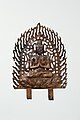 Bodhisattva aux mains jointes. Plaque bordée de flammes ajourées. Bronze doré, H. 24 cm, v. 680