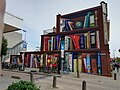 Muurschildering Boekenkast van JanIsDeMan op de hoek met de Mimosastraat