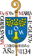 Sceau montrant une crosse surmontée d'un écu frappé d'un olivier, et entouré du texte « Monasterio de Sta Maria de La Oliva — Carcastrilo — Año 1134.