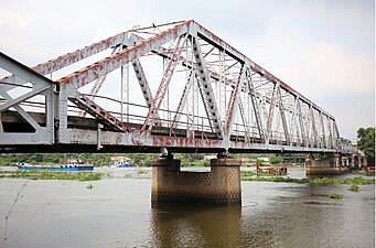 The historic Phú Long iron bridge used for trains on Saigon – Lái Thiêu – Lộc Ninh railway, now is no longer use and was demolished.