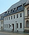 Ehemaliges Bergamt, jetzt Wohnhaus in geschlossener Bebauung, mit Gedenktafel für Oberberghauptmann von Trebra