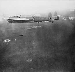 Four-engined military aircraft in flight