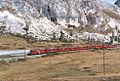 Two motor coaches of RhB in MU pulling the maximum allowed load of 140 t on the Bernina line