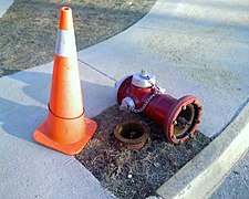 A fire hydrant that was hit by a snowplow and knocked over, damaging only the sacrificial bolts