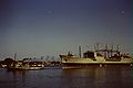 HMAS Supply (A195) under tow in the Brisbane River, in late 1967