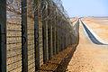 Image 4A more recent section of the Israel-Egypt barrier fence, north of Eilat, June 2012. It is a border barrier built by Israel along its border with Egypt. It was originally an attempt to curb illegal migrants from African countries.[1] Construction was approved on 12 January 2010[2] and began on 22 November 2010.[3]