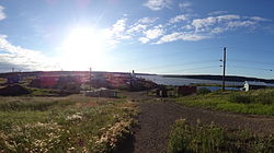 The Church in Tsiigehtchic with the Arctic Red River and Mackenzie River in the background