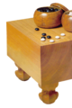 Image 4A traditional Japanese set, with a solid wooden floor board (碁盤 goban), 2 bowls (碁笥 goke) and 361 stones (碁石 goishi) (from Go (game))