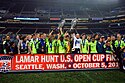 Sounders FC players lift the 2009 and 2010 U.S. Open Cup trophies after repeating as champions by winning the 2010 final.