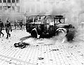 This boy's dead, burning body shows damage done by a V-2 on a main intersection in Antwerp, on a main supply line to Holland, 1944.