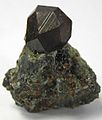 Image 26Black andradite, an end-member of the orthosilicate garnet group. (from Mineral)