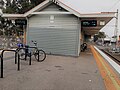 Southbound view from Platform 2, showing directly at station building, June 2019