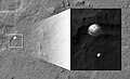 The HiRISE camera images the Curiosity rover suspended from its parachute during descent through the Martian atmosphere.