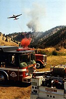 In this picture, retardant drops, bulldozer fire-lines and firing operations are used in an indirect attack on a large fire near Chelan, WA.