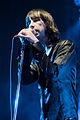 Colour photograph of Bobby Gillespie singing live in 2009