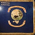 Indiana battle flag used during the American Civil War utilizing the state seal. One of a few Indiana battle flags used during the war. Uses symbols that were later used on the first Indiana state flag.[13]