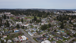 Aerial view of the neighborhood, with West Hills S.T.E.M. Academy in the center left and Puget Sound Naval Shipyard on the far right.