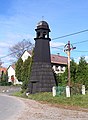 Glockenturm an der Straße in Záchlumí