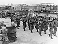 Image 16Gurkhas guide disarmed Japanese soldiers from Bangkok to prisoner of war camps outside the city, September 1945 (from History of Thailand)