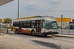 A white, red and orange bus