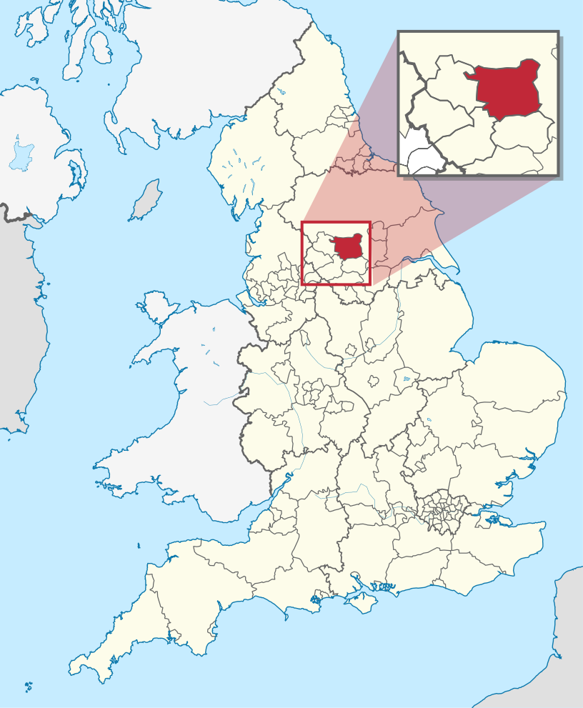 A map of England coloured pink showing the administrative subdivisions of the country. The Leeds metropolitan borough area is coloured red.