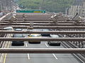 Cars eastbound on the Brooklyn Bridge, entering Brooklyn.