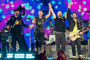 Coldplay preparing to bow on stage after performing