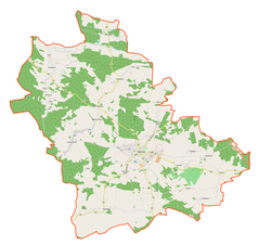 Mapa konturowa gminy Kożuchów, blisko centrum na dole znajduje się punkt z opisem „Kożuchów”