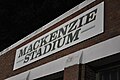 A stadium sign located near the left field entrance