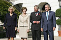 President George W. Bush and First Lady Laura Bush with Charles, Prince of Wales and Camilla, Duchess of Cornwall at the White House during the Waleses' official visit to the United States, 2005.