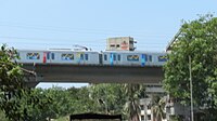 A metro train on an elevated viaduct