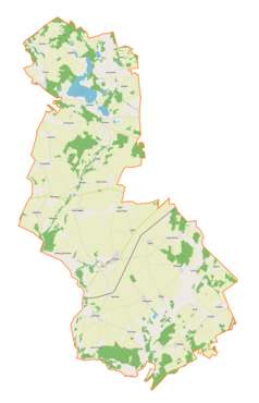 Mapa konturowa gminy Kozłowo, blisko centrum u góry znajduje się punkt z opisem „Parafiapw. świętego Józefaw Szkotowie”