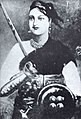 Rani Lakshmibai, Rani de Jhansi, una de les principales líderes de la rebelión de la India de 1857, quien enantes perdiera'l so reinu como resultancia del Periodu de Doctrina de James Broun-Ramsay, primer marqués de Dalhousie, lord Dalhousie.