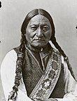 Black-and-white photo of Sitting Bull looking directly into the camera