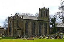 A stone church with a square tower