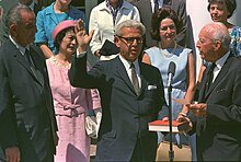 Dorothy Kurgans Goldberg (in pink) stood next to President Lyndon Johnson and behind her husband, Arthur Goldberg, when he was sworn in as United States Ambassador to the United Nations in 1965; also in the photograph are Lady Bird Johnson (in a blue suit) and Supreme Court Justice Hugo Black (on the right).