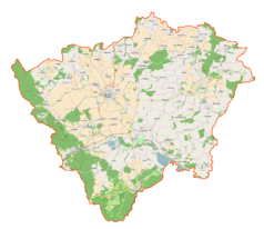 Mapa konturowa powiatu ząbkowickiego, po lewej znajduje się punkt otoczony kołem zębatym z opisem „Twierdza Srebrna Góra”