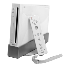 Console de jeu vidéo Wii, boitier blanc, avec une manette de jeu.