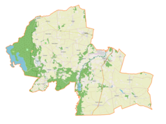 Mapa konturowa gminy Kurzętnik, blisko centrum na prawo znajduje się ikonka zamku z wieżą z opisem „Zamek w Kurzętniku”