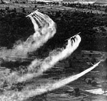 Three US Fairchild UC-123B aircraft pictured spraying Agent Orange