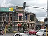 Photo of a two storey building with earthquake damage.