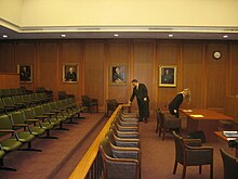 Courtroom preparing for a hearing.