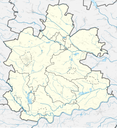 Mapa konturowa powiatu buskiego, po lewej znajduje się punkt z opisem „Zbludowice”