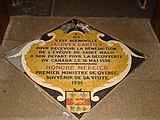 Plaque marking the spot where Jacques Cartier knelt to receive the blessing of the bishop of Saint Malo before his voyage to Canada in 1535. The plaque records that Honoré Mercier the Prime Minister of Quebec visited the cathedral in 1891.