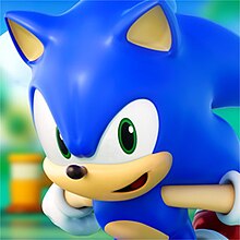 Sonic the Hedgehog runs to the left whilst looking at the player in front of a blurred background.