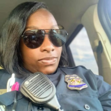 Selfie of Holley in police uniform.