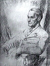 Half-portrait of seated man in military uniform