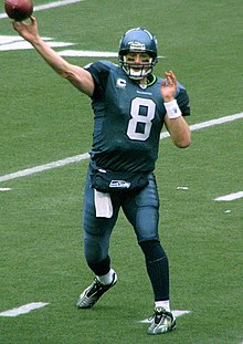 Hasselbeck throwing the football during a game