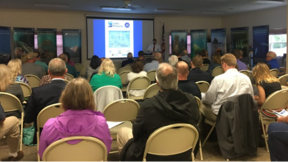 People seated at a meeting