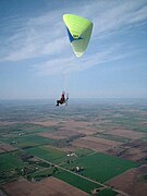 A powered paraglider in flight